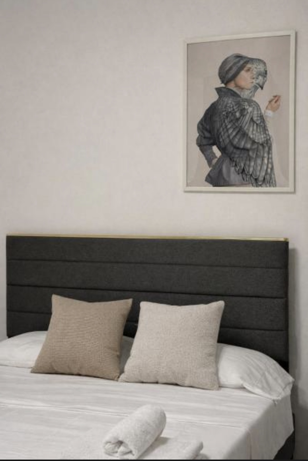 The Urban Lodge bedroom with dark upholstered headboard